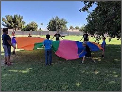 Children playing with parachute